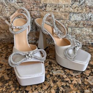 MACH & MACH 140 CRYSTAL DOUBLE BOW PLATFORM SANDALS IN SATIN